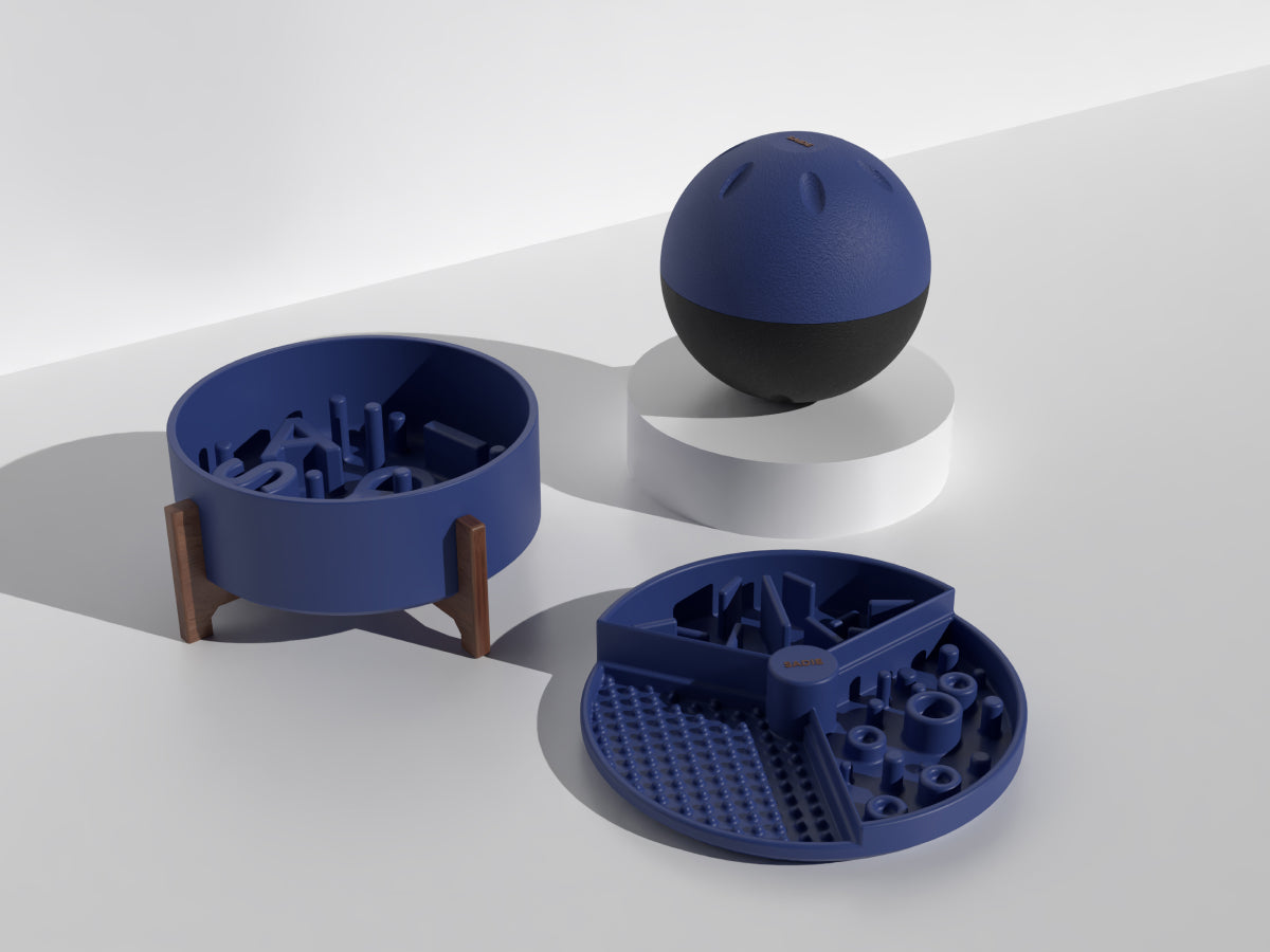 Blue pet toys including a ball, bowl, and puzzle toy on a white background