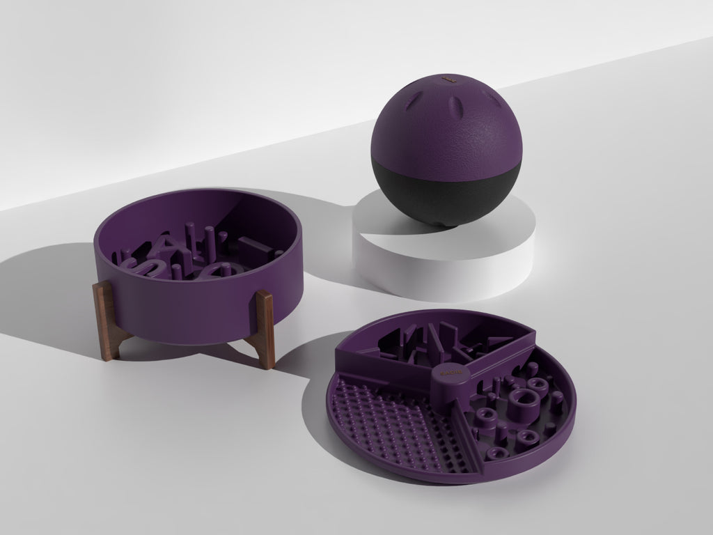 Purple pet toys including a ball, bowl, and puzzle toy on a white background