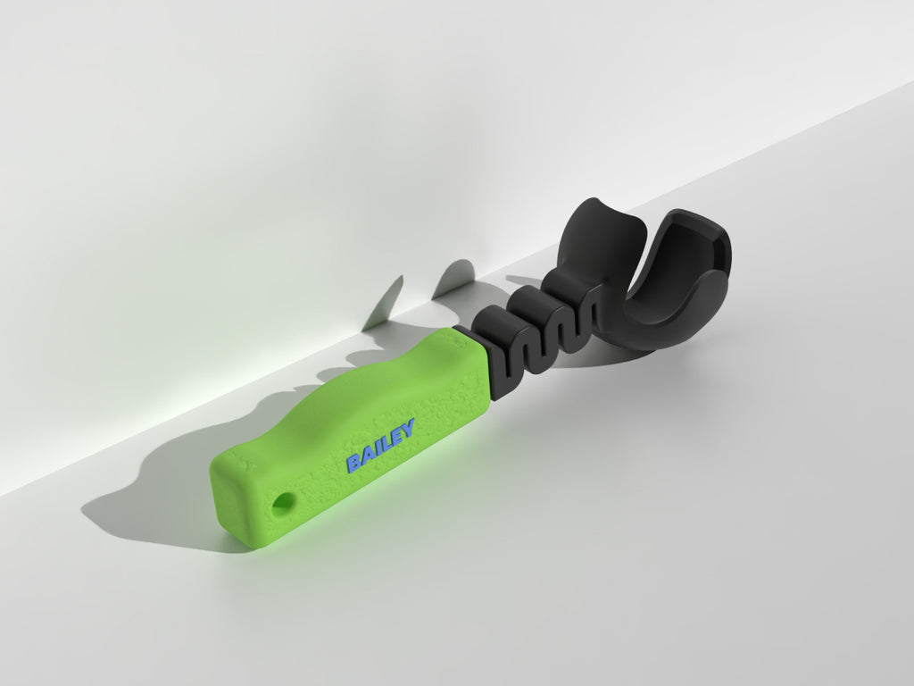 Ball thrower with green handle