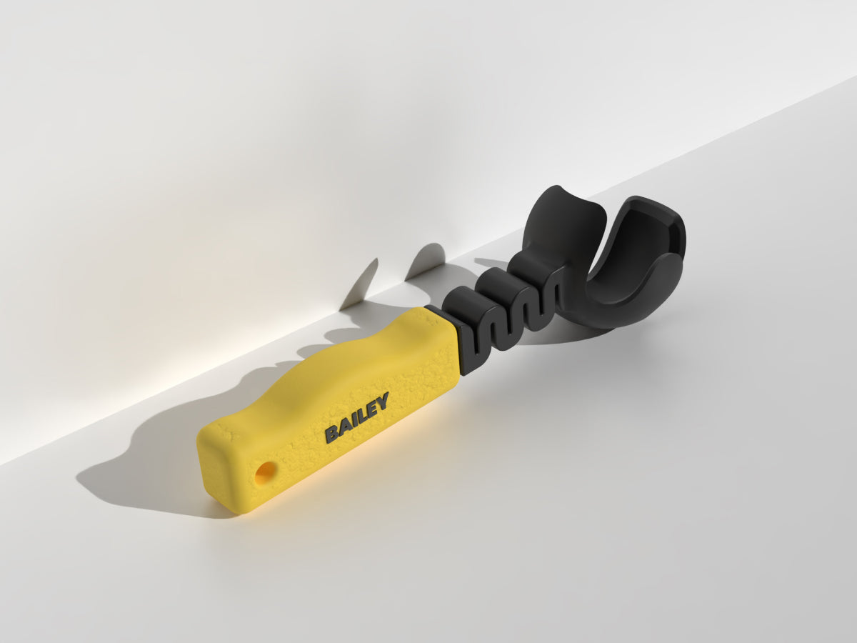 Ball thrower with yellow handle